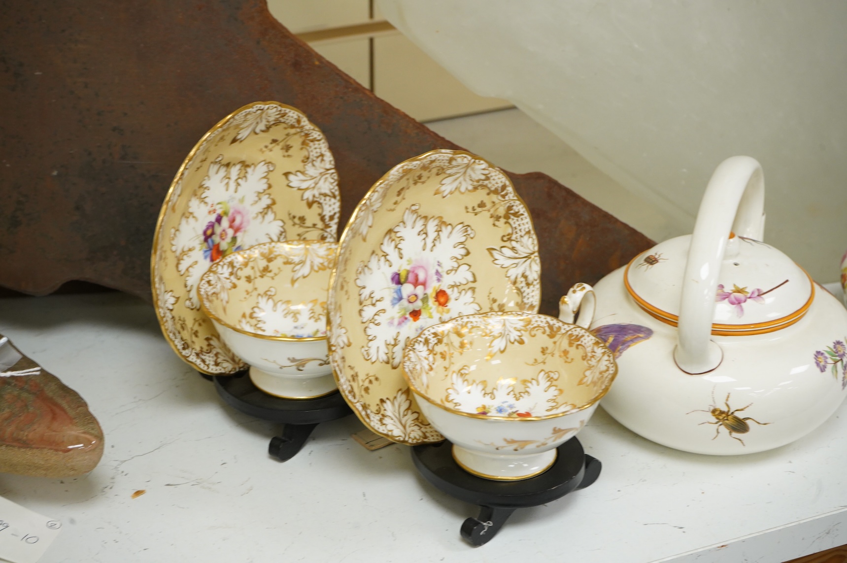 An early 19th century Derby three piece tea service, A pair of Staffordshire cow groups, Wedgwood etc